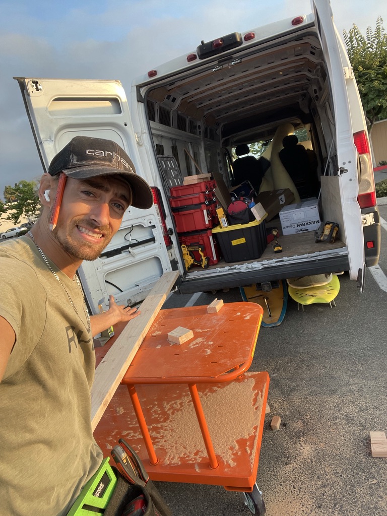 Nathaniel on a job with his work van