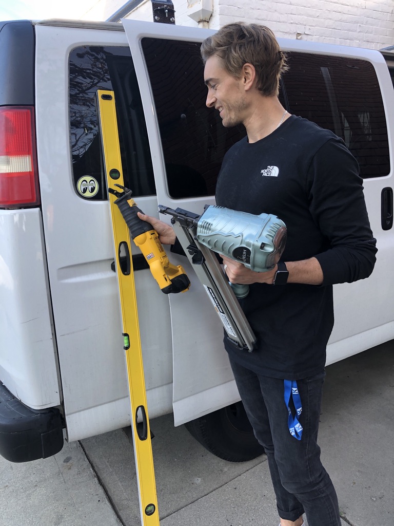 Nathaniel with his tools at the work van